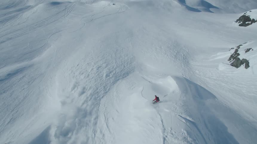 Aerial view of a person skiing on a mountain