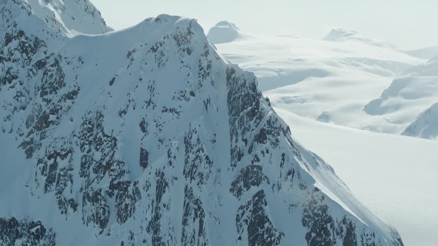 Aerial panorama of snowy mountains daytime view