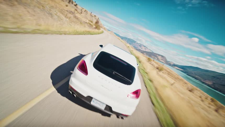 A clip of a white car moving on the freeway