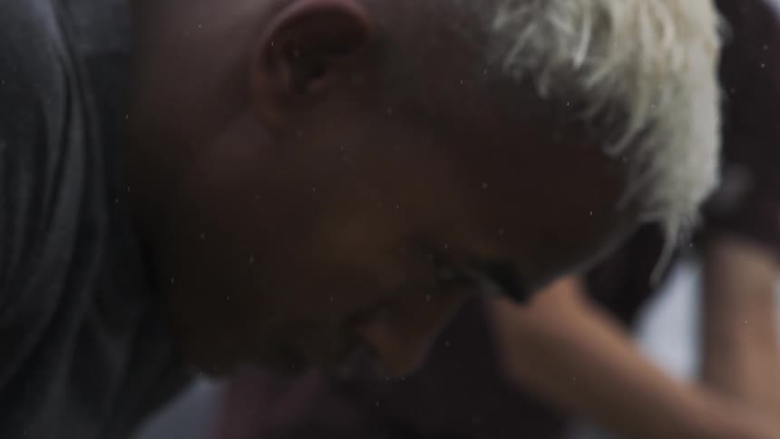 Side portrait of a man with his head down