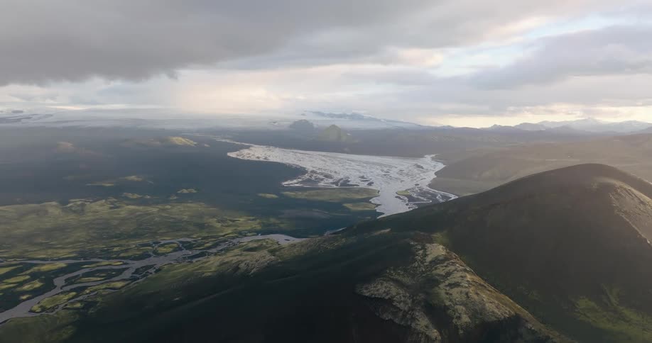 Aerial panorama of a mountain valley and a river in the background