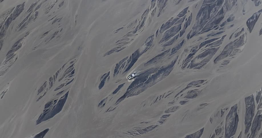 Aerial view of a car crossing a river