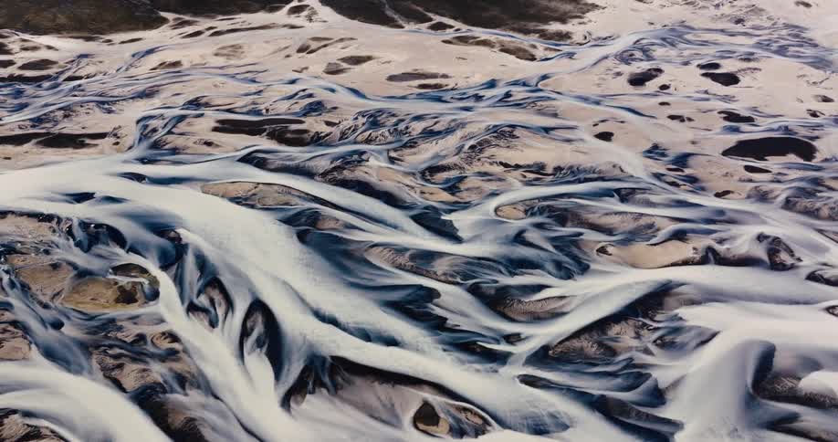Aerial view of a landscape with intricate patterns of watercourses