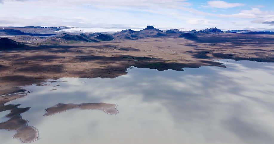 Aerial landscape of a mountain valley with snowy areas