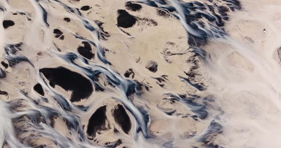 Aerial view of desert dunes with water ballast