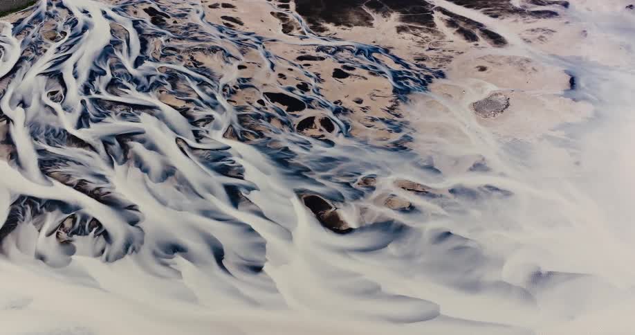 Aerial view of a landscape with intricate river patterns