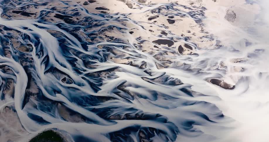 Aerial view of a landscape that mixes water and sand formations