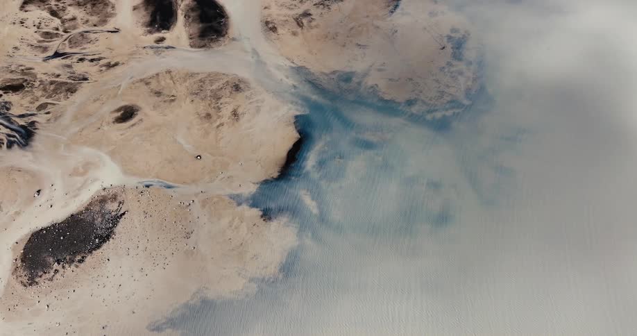 Aerial view of a calm lake on dry land
