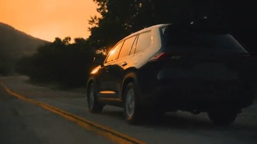 SUV driving out of the mountains during a wildfire