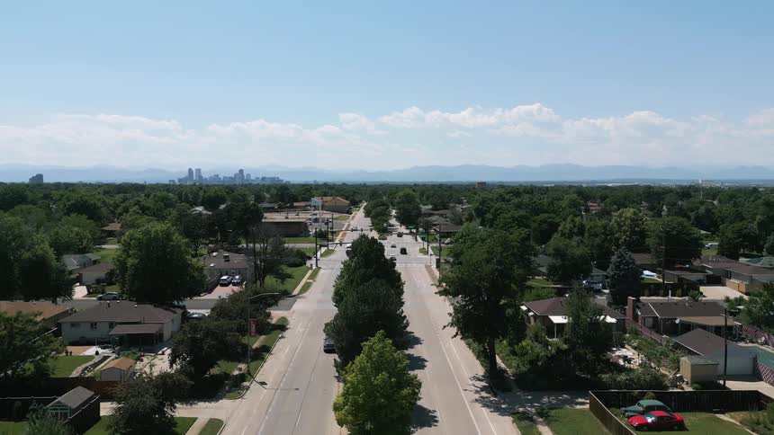 Aerial view of a street with vehicle traffic and surroundings in urban city