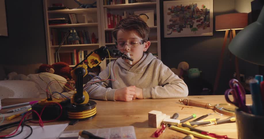 A clip of a boy testing a robot