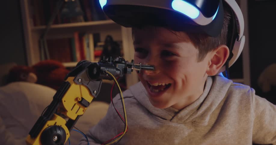 Robotic arm interacts with a child wearing a virtual reality headset