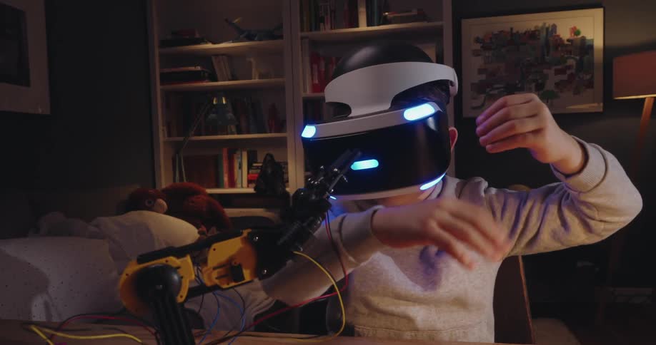 A clip of a boy testing a virtual headset