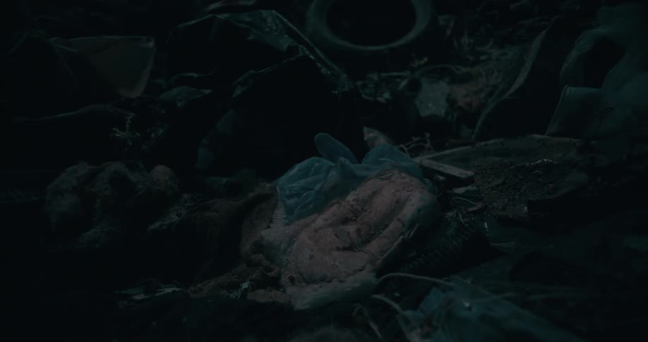 Garbage thrown on a rainy day at night