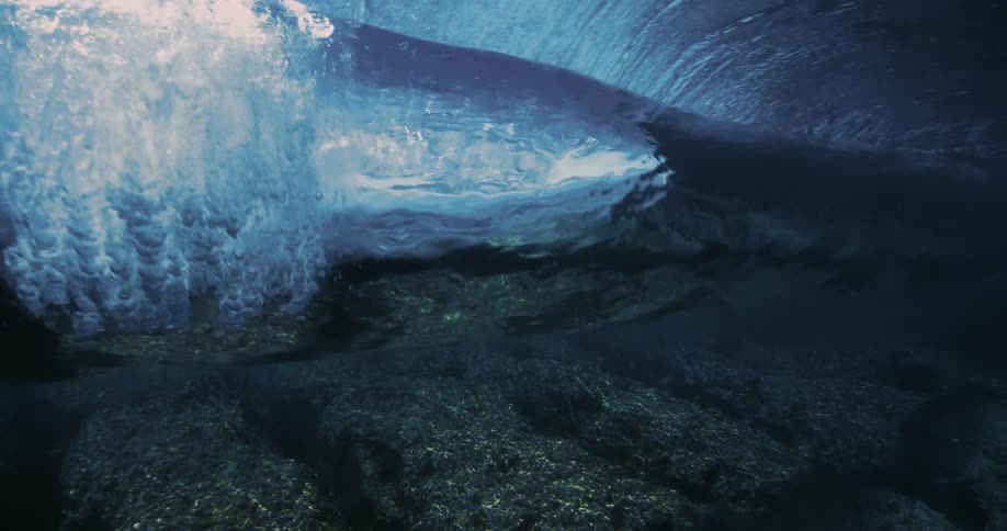 Underwater view of a rolling wave