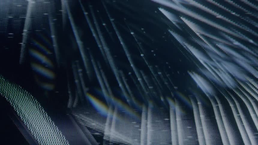 A rotating pixelated tunnel of converging triangles creates a hypnotic visual effect