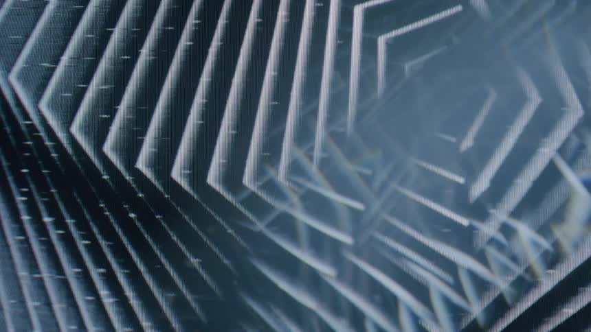 A series of white lines form a pattern that moves in a continuous way