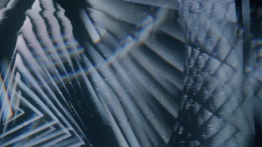 A spinning pattern of overlapping triangles creating a sense of depth and perspective
