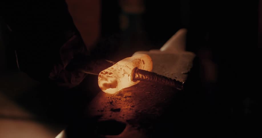 Close up of a hammer welding an object