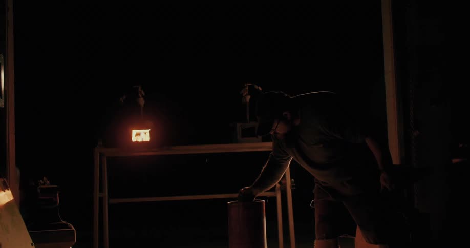 Man forging a heated metal and placing it in water