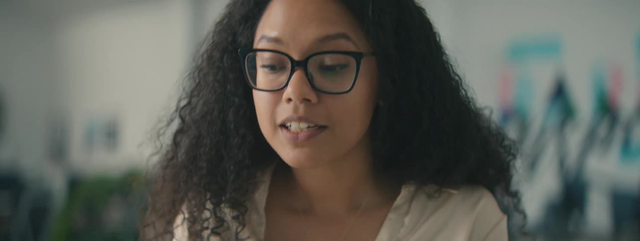 A woman is talking and moving her hands