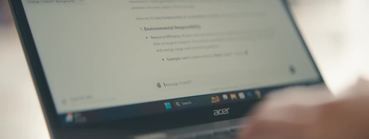Hands of a person typing on a laptop