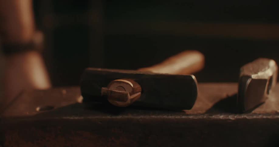 A man puts down his tool