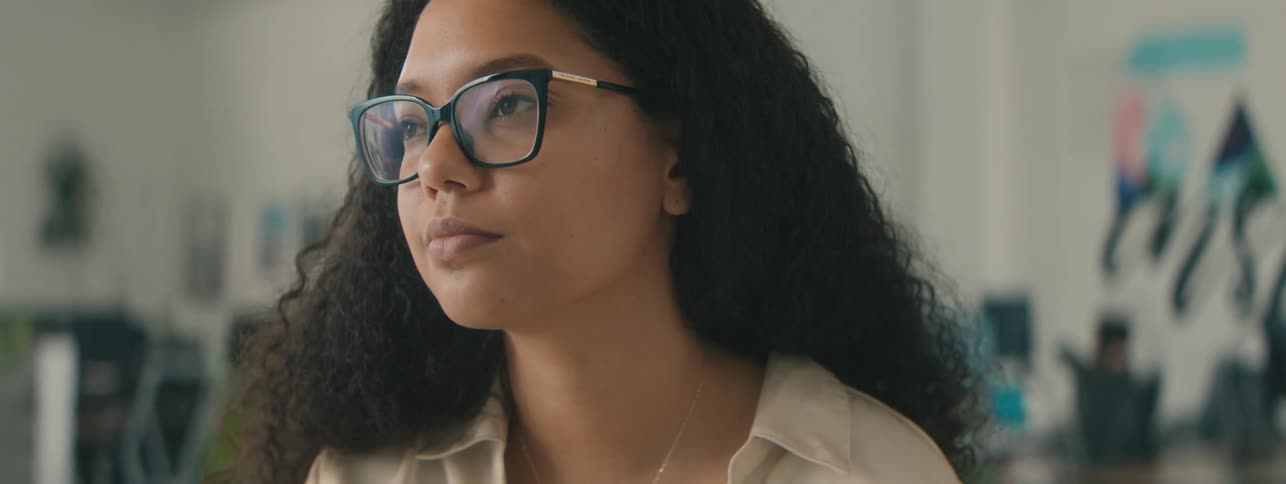 A woman is thinking about something as she blinks