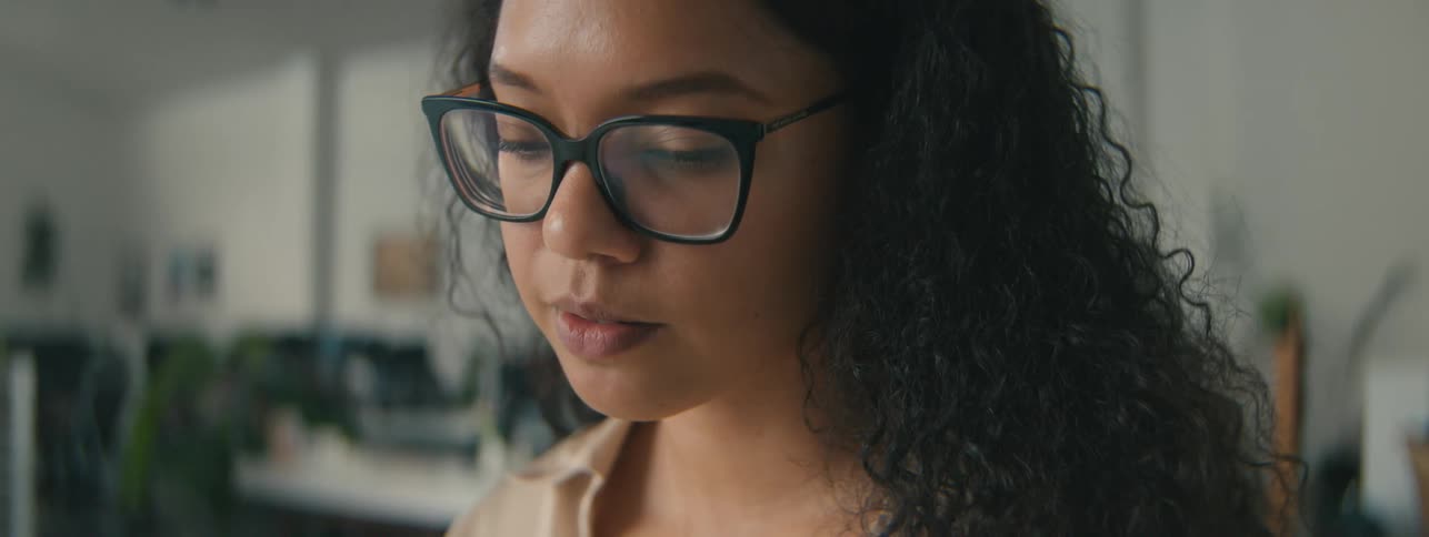 Portrait of a thoughtful young curlyhaired woman