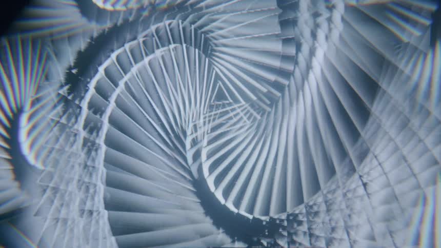 A spinning pattern of overlapping triangles creating a sense of depth and perspective