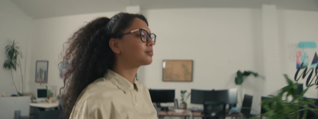 A woman walks through the office