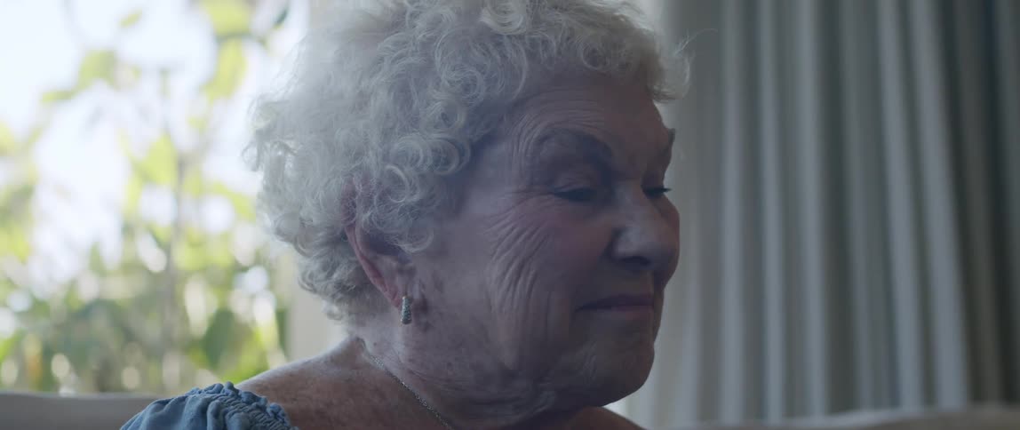 Portrait of an elderly woman in the living room