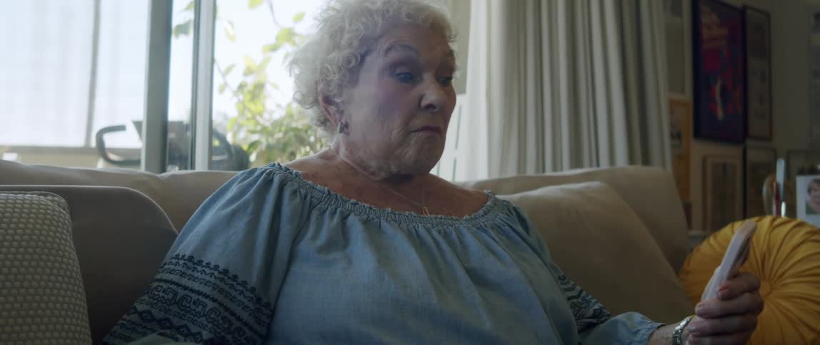 A clip of a granny operating a phone