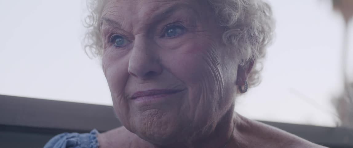 Portrait of an elderly lady giving a slight smile