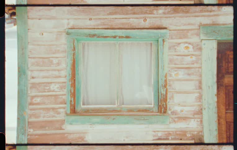 Exterior architecture of wooden window next to a door of a house