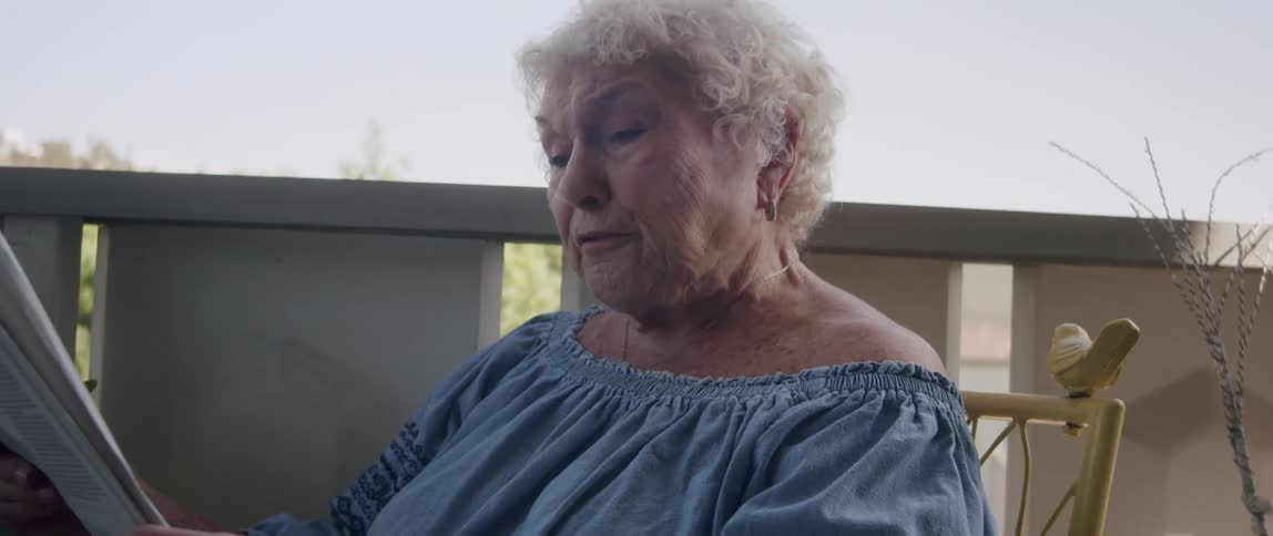 A clip of a granny reading a magazine