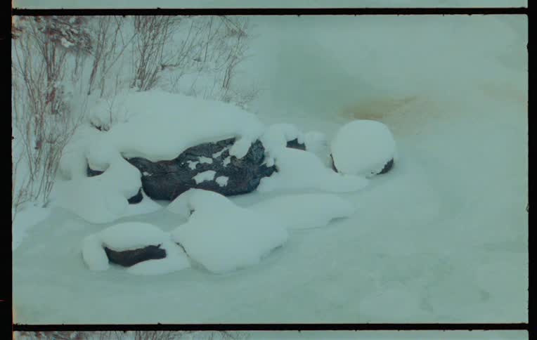 Rocks in a natural environment covered by snow