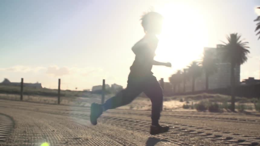 A kid running on dirt