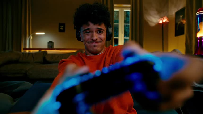 Teenager playing video games and getting disappointed