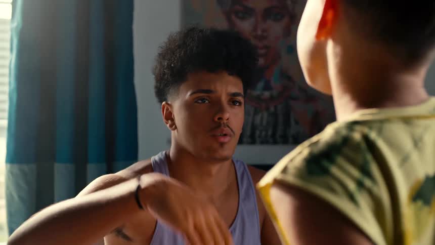 Teenager complimenting a little boys double biceps