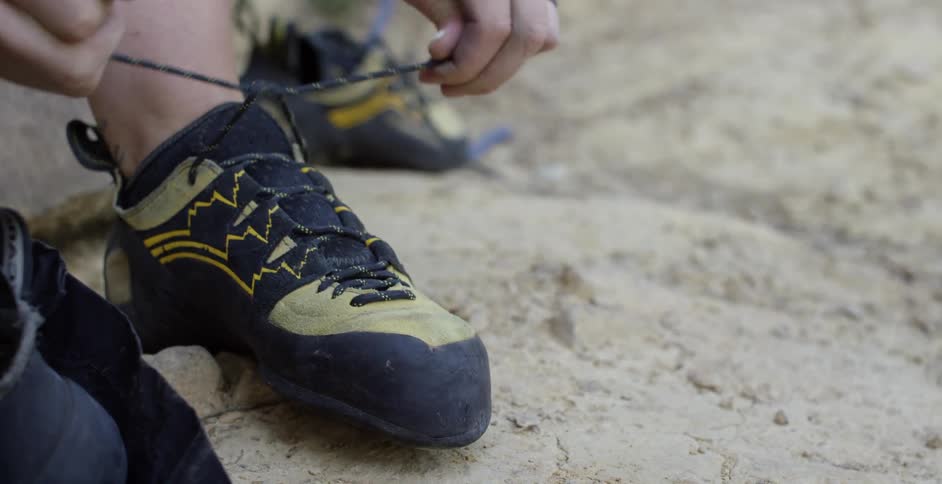 A man ties his shoe