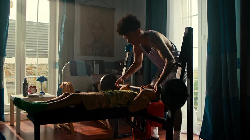 A clip of two boys weight lifting