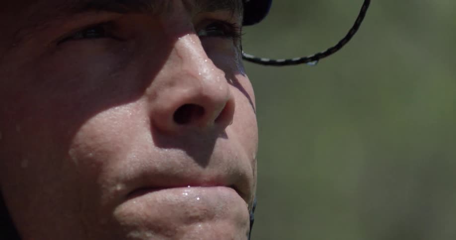 Extreme close-up of a kayaker wearing a blue helmet