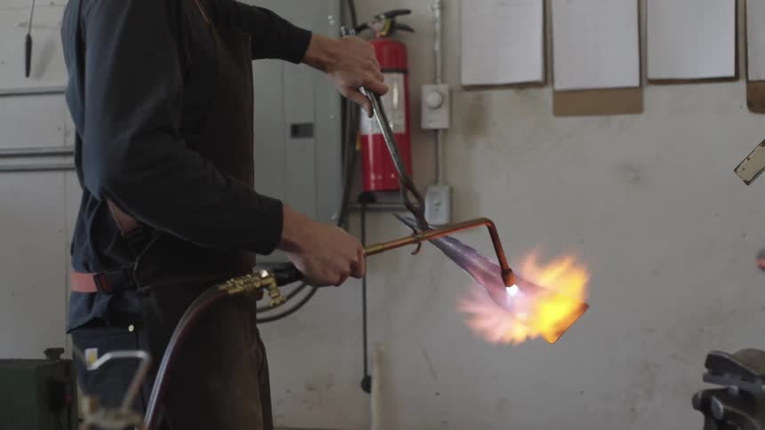 A clip of a person heating an iron