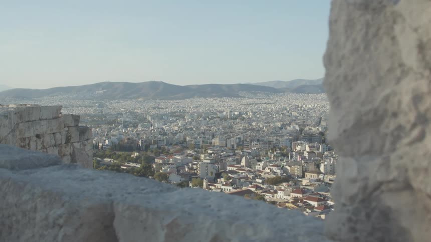 Top view of an urban city surrounded by mountains