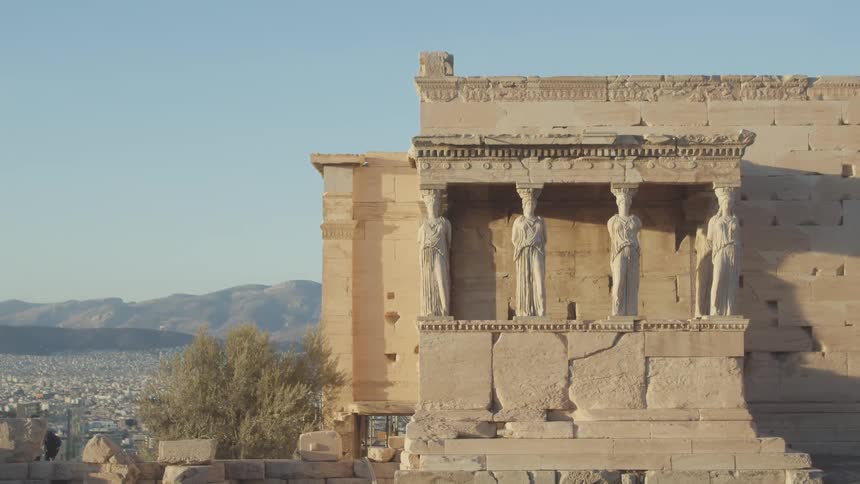 Classical architecture of columns on a hill with mountains on the horizon