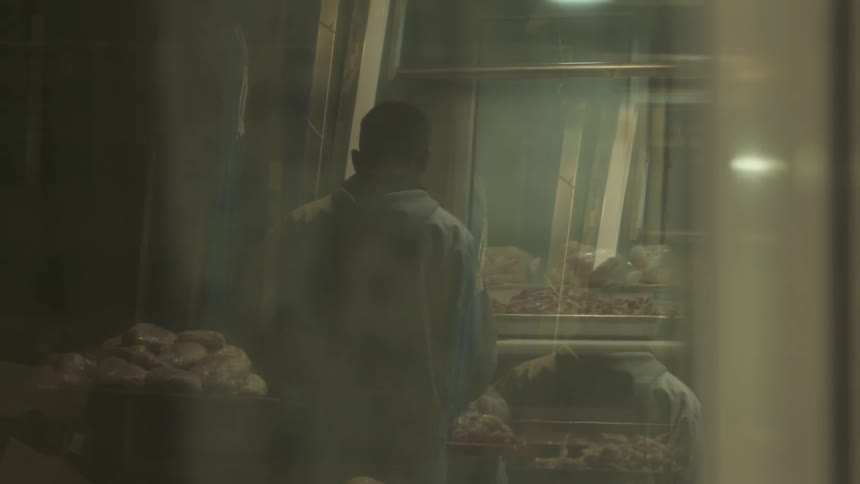 View from a window of a person facing a butcher shop