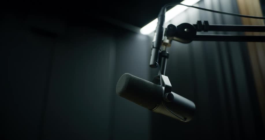 A microphone is in the empty studio