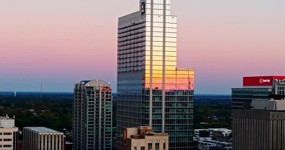 Aerial of a pnc bank building in a metropolis at sunset