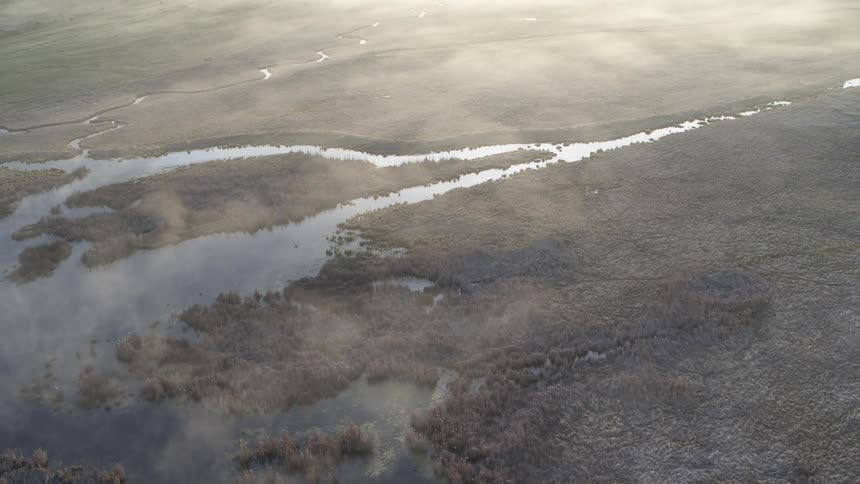 Aerial view of a landscape with a meandering river